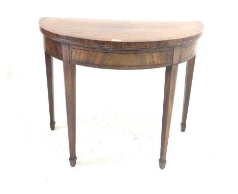 George III inlaid mahogany demi-lune card table, baize lined playing surface, raised on square tapered support with peg feet 