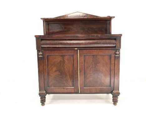 Early 19th century mahogany chiffonier side cabinet, the raised arched back with open shelf over cushion frieze drawer and tw