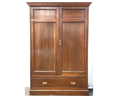 Late 19th/ Early 20th century mahogany wardrobe, moulded cornice over two panelled doors, drawer to base W140cm, H202cm, D57c
