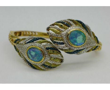 A silver gilt bangle set with peacock quartz and diamonds