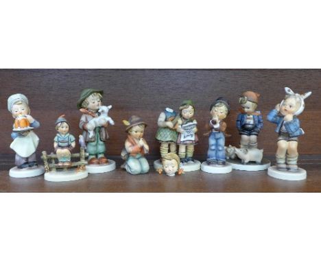 A collection of eight Hummel figures, five restored, one a/f