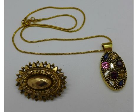 A yellow metal brooch and a pendant and chain, brooch pin repaired