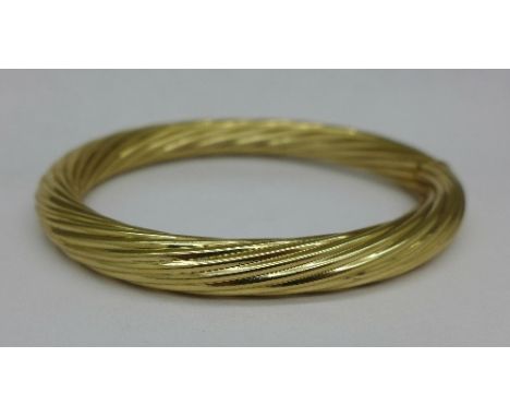 A 9ct gold bangle, 19.6g