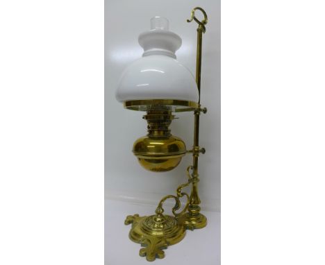 A brass oil lamp, Jas Lee, Liverpool, the lamp on a sliding stand