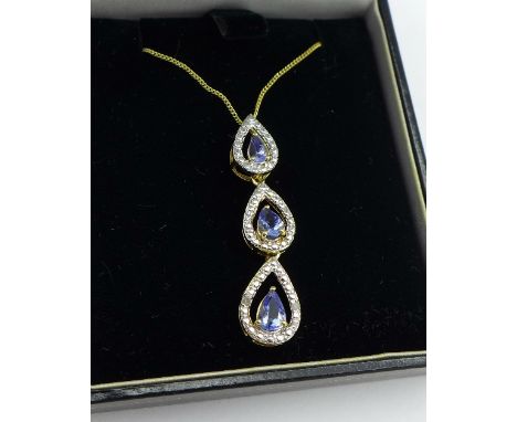 A silver gilt, tanzanite and diamond pendant with chain