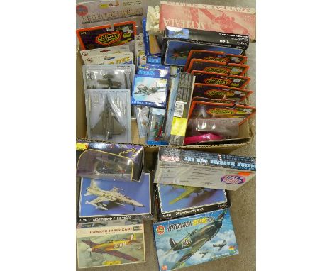 A collection of model aircraft, die-cast and model kits