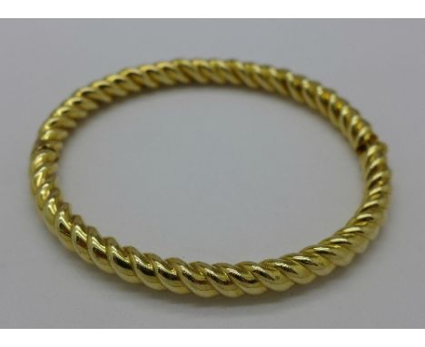 A 9ct gold bangle, 15.3g