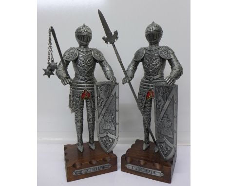 A pair of model knights in armour on wooden bases