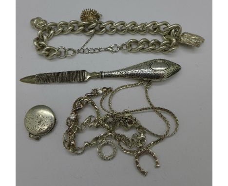 Two silver bracelets, a locket, a chain and a nail file, weight of silver 94g
