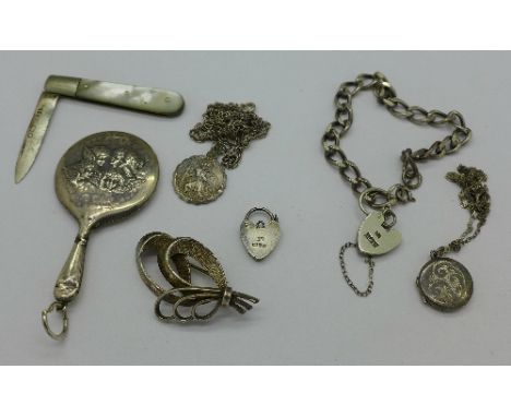 A miniature silver Art Nouveau mirror, silver a/f, a mother of pearl and silver knife, a silver bracelet, a silver chain, a S