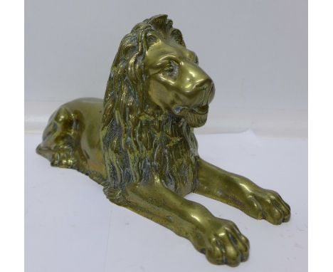 A solid brass model of a lion, 30cm