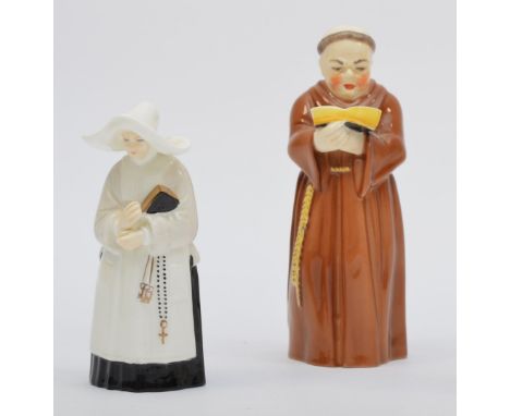 Royal Worcester, a fine bone china candle snuffer in the form of a monk, 12cm and another of a nun, 9.5cm.