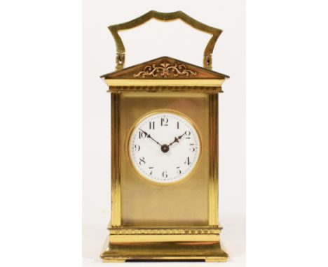 A French brass carriage time piece, the white enamel dial with Arabic numerals, signed 11 jewel movement, architectural case,