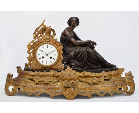 A 19th century French bronzed spelter and gilt metal mantel clock, the white enamel with Roman numerals, with seated classica