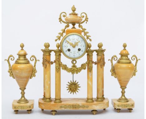 J. Bernard, Montlucon, a 19th century French cream variegated marble and ormolu clock garniture, the white enamel dial with f