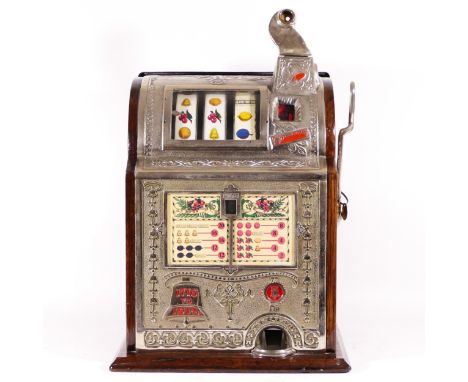 A Mills Operators Bell Spearmint slot machine, one arm bandit, c.1915, restored and working on a American 5 cent coin, wooden