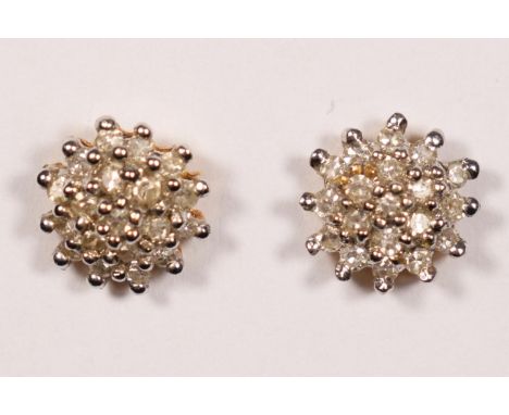A pair of 18ct gold and diamond cluster ear studs, stated weight 0.28cts, diameter 8mm, 2gm.
