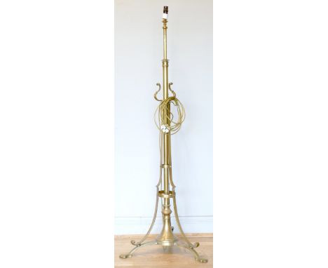 An Arts and Craft W.A.S. Benson style adjustable standard lamp, raised on a tripod base, 145 - 165cm.
