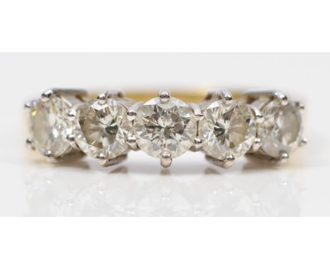 An 18ct gold five stone diamond ring, claw set with brilliant cut stones, stated weight 1.50cts, colour estimate J/K, clarity