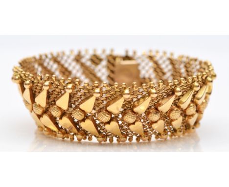 An Italian 18ct gold woven bracelet, stamped 750, with applied decoration,17.5cm, 33.1gm 