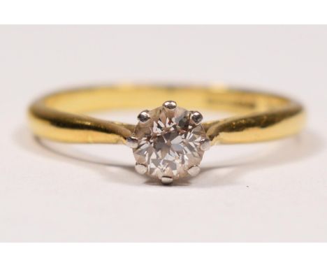 An 18ct gold single stone diamond ring, claw set with an old cut brilliant stone, weighing approximately 0.50cts, colour esti