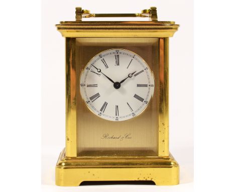 A Richard &amp; Cie, brass striking carriage clock, white enamel dial, the 13 jewel movement striking on a bell, 12.5cm.