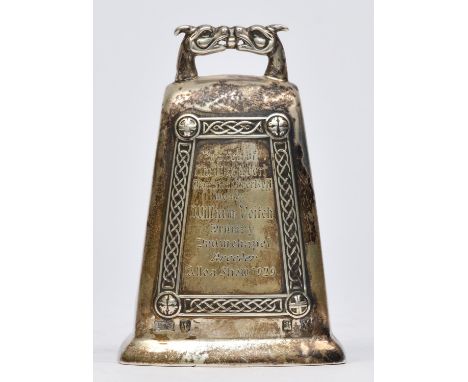 A Scottish silver presentation hand bell, Edinburgh 1929, with applied Celtic border, clanger, 9cm, 78gm. Inscribed "Replica 