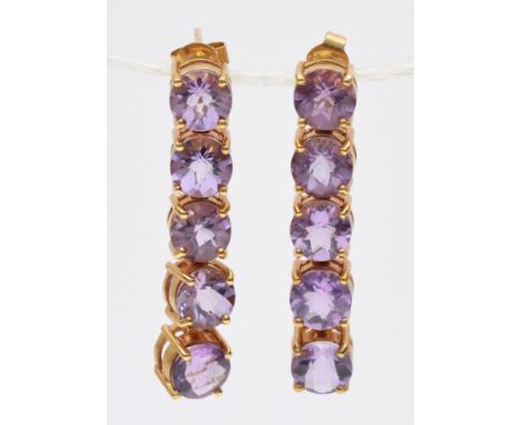 A 9ct gold pair of amethyst drop ear rings, articulated claw set with facetted stones, length 33mm, 6.8gm