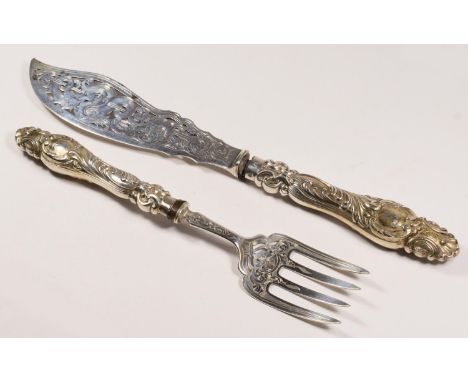 A Victorian silver pair of silver knife and fork, by Martin Hall &amp; Co., Sheffield, 1853, the handles loaded, pierced and 