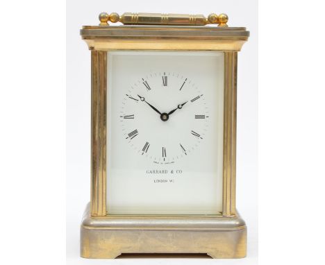 Garrard &amp; Co., London, a large brass striking carriage clock, the white enamel dial with Roman numerals and signed, the 1