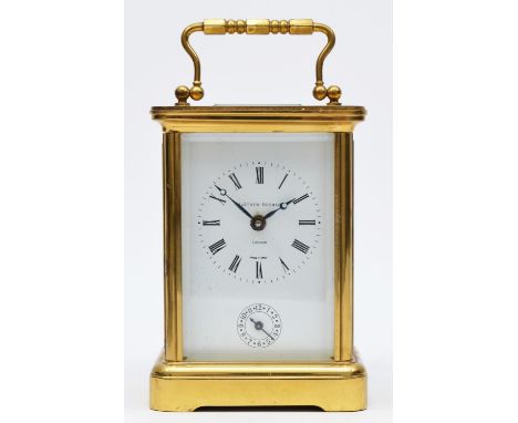 Matthew Norman, London, a brass alarm carriage clock, the white enamel dial with Roman numerals and subsidiary alarm dial, th