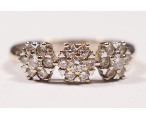 An 18ct white gold triple cluster ring, heart claw set with brilliant cut stones, stated weight 0.50cts, colour estimate G/H,