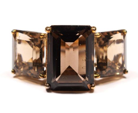 A vintage 9ct gold and smokey quartz three stone ring, the largest 14 x 9mm, N, 6.4gm.