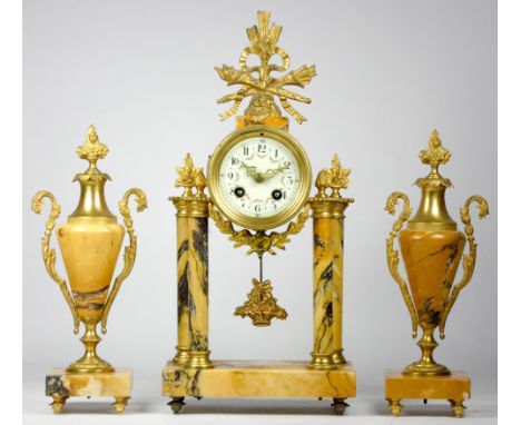 A French Empire mid-19th century marble and gilt brass mounted clock garniture having an eight-day duration movement striking