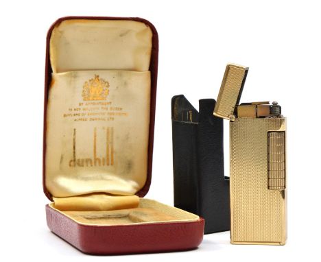 Dunhill, a 9ct gold rollagas cigarette lighter, London 1967, with engine turned decoration, 105gm, original leather slide and