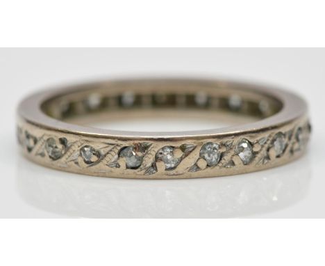 A white metal and diamond full eternity ring, probably platinum, set with single cut stones, L, 3.7gm