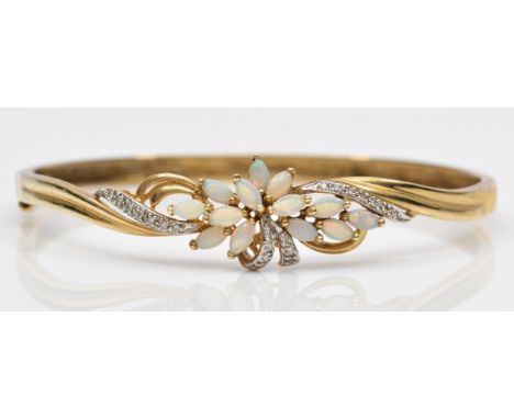 A 9K gold opal and diamond floral spray fronted bracelet, 59 x 50mm internal, 10.8gm