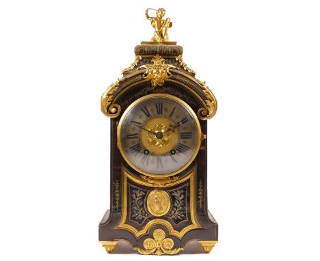 A 19th century French boulle mantel clock, the 14 cm dial with silvered chapter ring, the red tortoiseshell and gilt brass ca