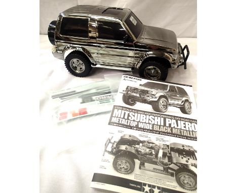 Tamiya 1:10 scale Mitsubishi Pajero, chrome body, requires motor battery, radio control etc. P&amp;P Group 3 (£25+VAT for the