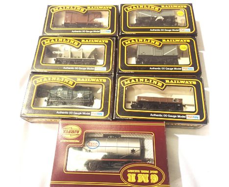 Seven OO scale wagons, tankers, hopper, van, opens, Mainline x6, Airfix x1, mostly in excellent condition, boxed. P&amp;P Gro