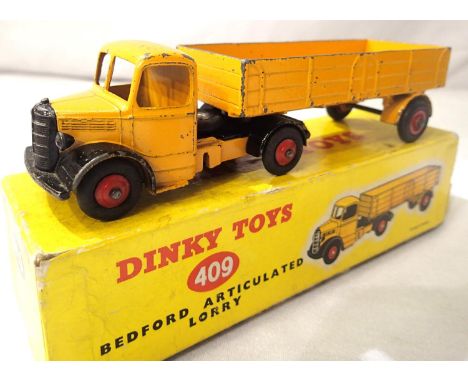 Dinky Toys 409 Bedford Artic lorry yellow with red wheels, good condition with some paint chips, rubs etc. Box is fair with s