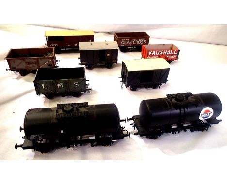 Nine O gauge wagons; kit built and Lima, tankers x2, opens, brake, box etc. all unboxed with some damage and missing parts, o