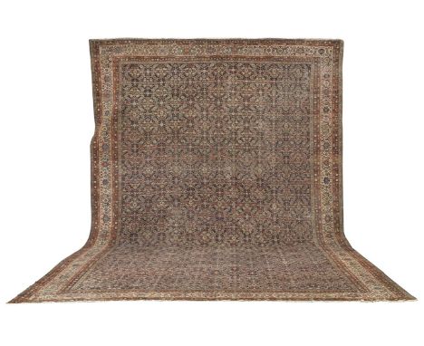 A large Fereghan carpetCentral Persia, c.1890with all-over herati design on rich indigo field within corresponding cream bord