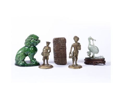 Group of pieces Chinese comprising a green glazed lion dog, a boxwood carved seal, a jade crane on hardwood stand and two Ind