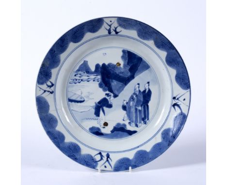 Blue and white dish Chinese, Kangxi Period (1662-1722) decorated to the interior with a central roundel enclosing a scene of 