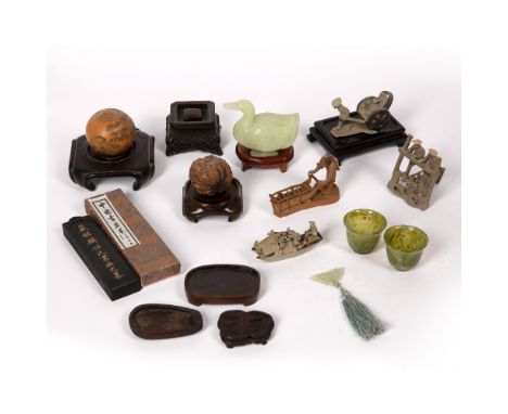 Group of pieces, Chinese to include a small jade model of a duck, a selection of small wooden stands, an ink block, two bowen