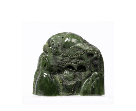 Spinach jade carving Chinese depicting a mountain and pine tree with scholar beneath, 12.5cm across, 10.5cm high