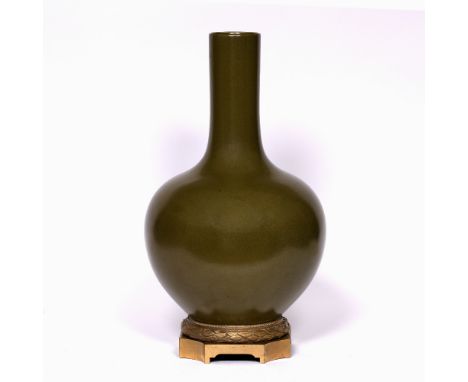 Eel-skin glaze bottle vase Chinese, 19th Century with ormolu mounted base and Qianlong seal mark, 43.75cm high