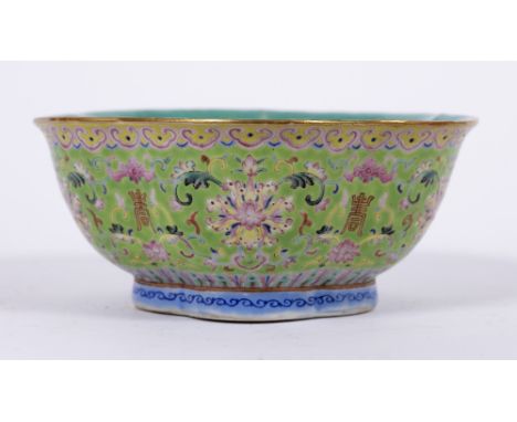 Green enamel decorated bowlChinese, 19th Centurydepicting a flowering plants with shou characters and bats, with Daoguang sea