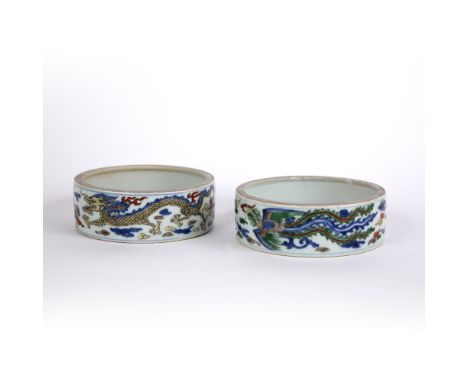 Pair of wucai decorated brush washers Chinese, 19th Century depicting two dragons chasing the flaming pearl, 4cm high x 13.5c